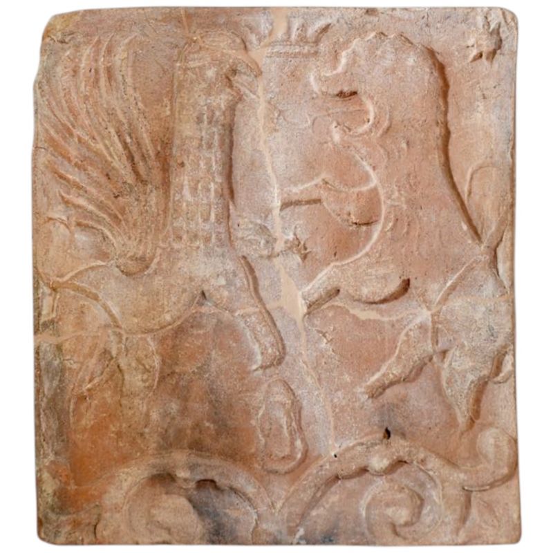 A tile depicting a battle between a lion and a griffin. Hetmanate. Late 17th–18th centuries.The menu features audio description and videos translated into USL